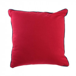 Coussin marin rayé à pompon rouge.